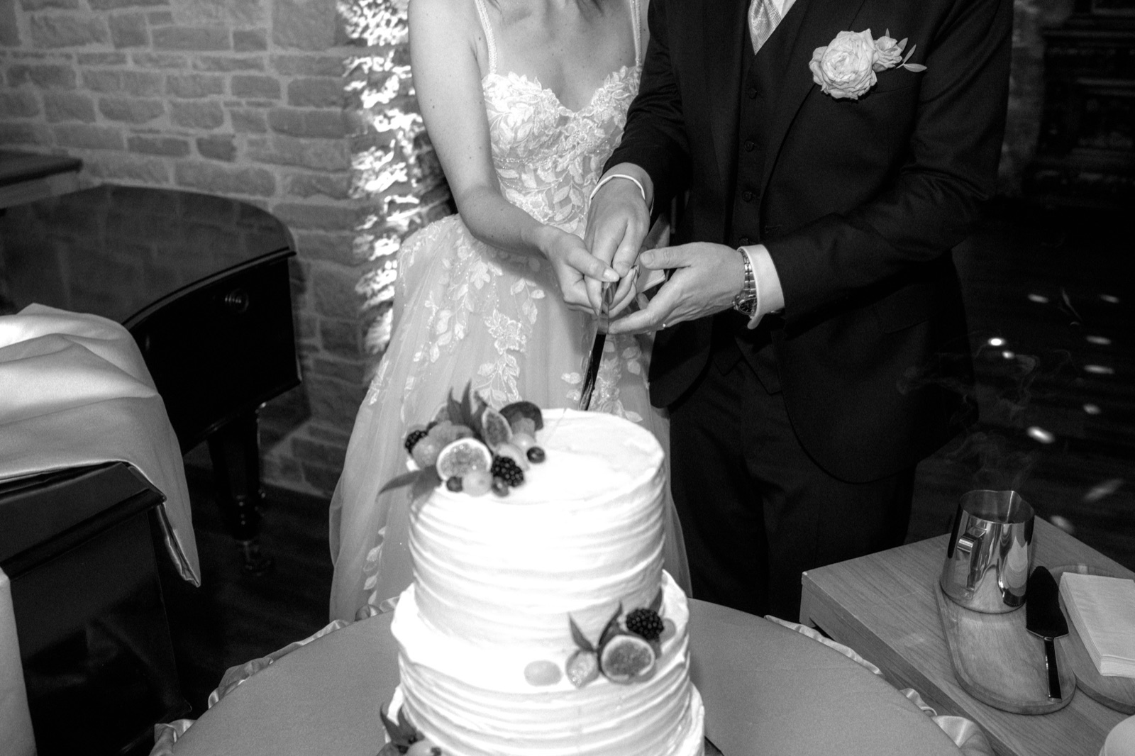 Couple cutting their wedding cake