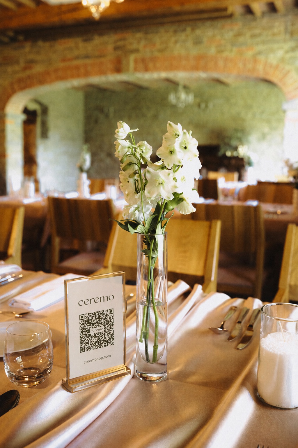 Ceremo QR code displayed on a wedding reception table